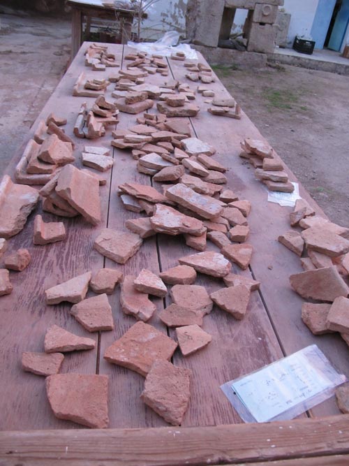 Pottery sherds on a table, Pella, Jordan (2011 season)