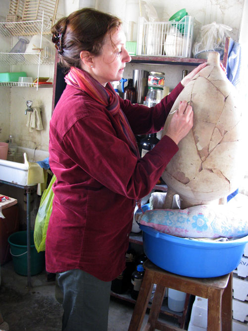 Wendy Reade working on the Rhodian amphora in her conservation lab at Pella, Jordan, in 2011