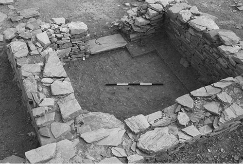 Archaeological photographs include a scale