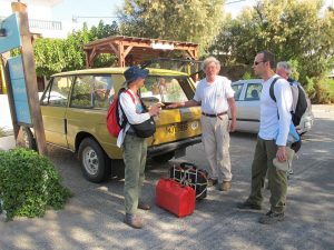 Richard Anderson (centre) and Zagora team members near his Range Rover