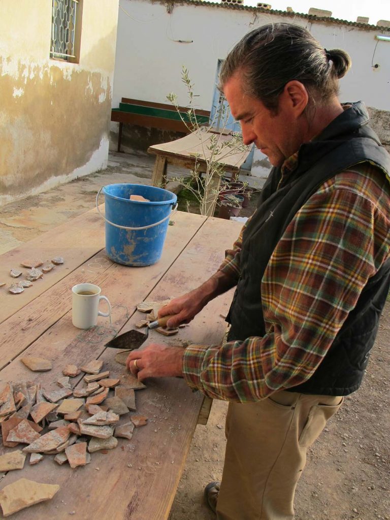 Paul working with sherds