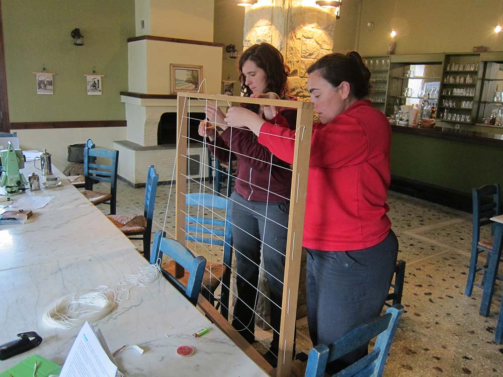 Hannah Morris (left) helps Archondia Thanos to string up a drawing frame