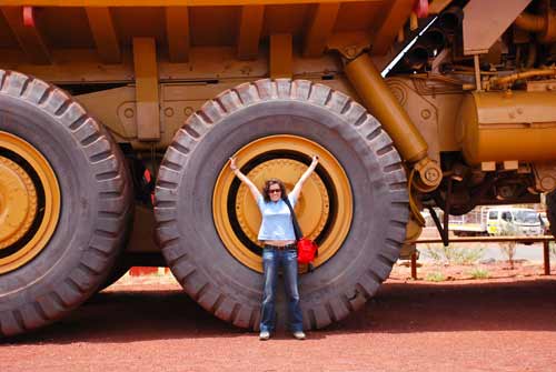 Guadalupe in front of a giant haul truck at Newman in WA