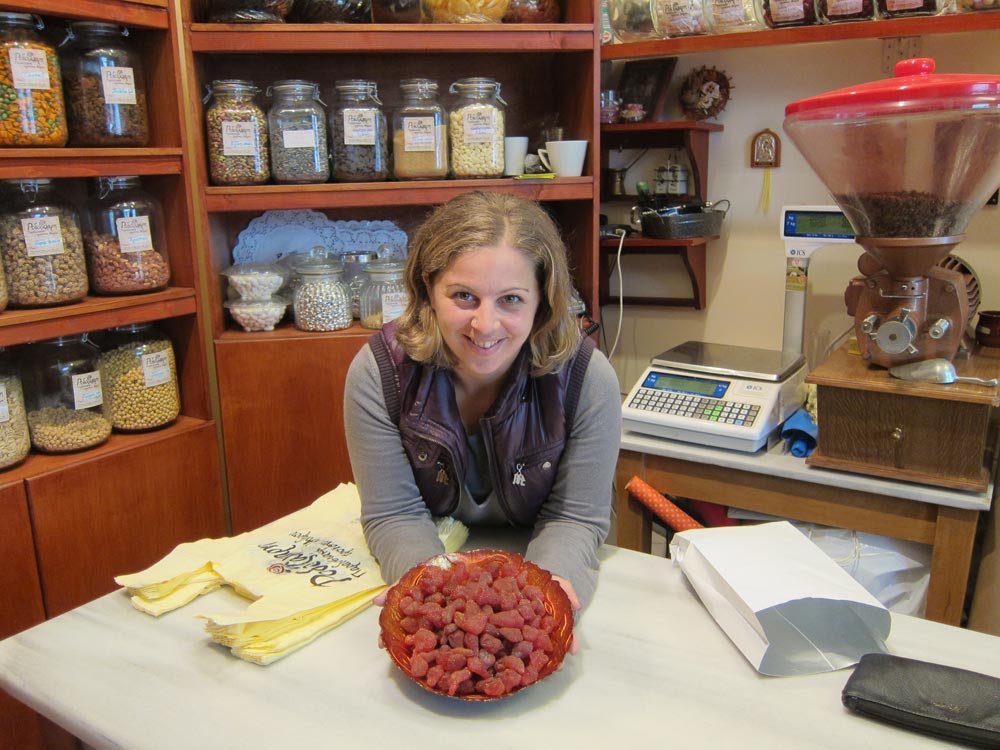 Antonia Pertes holding a bowl of delicious dried strawberries