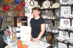 Sophia Melita behind her shop counter.