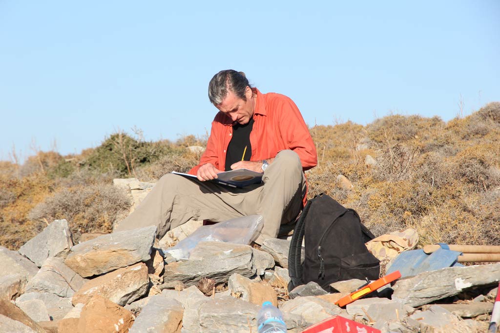 Paul Donnelly writing in his notebook at Excavation Area 5
