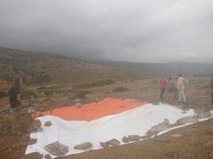 Covering up the excavation area with tarpaulin