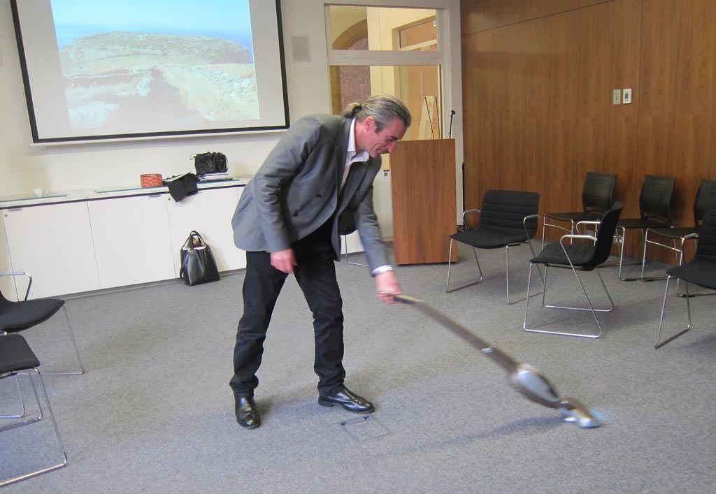 Paul Donnelly wields a vacuum cleaner