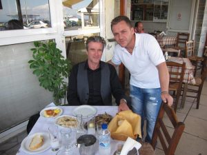 Paul Donnelly with our host at the seaside pavement cafe in Rafina