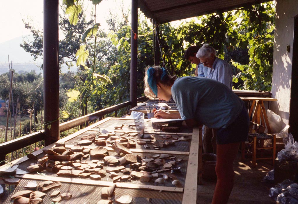 Beatrice McLoughlin in the foreground with Olwyn Tudor-Jones behind her; in the potshed at Torone in 1986